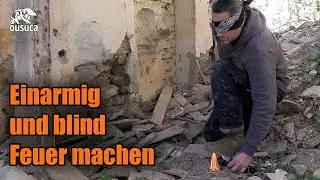 Einarmig und blind Feuer mit dem Feuerstahl machen