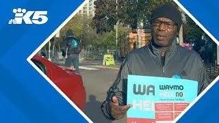 'Hell no, Waymo': Seattle rideshare drivers, union advocates rally against driverless taxi service