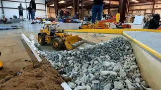 RC4WD 870K loader filling rocks in the dump truck