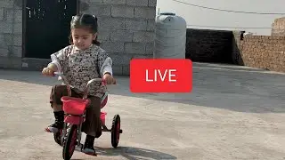 Mahnoor Ali is cycling and playing with sand