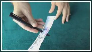 Lapicera que atraviesa Billete