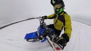 Learning to race around on the ice with a dirt bike.