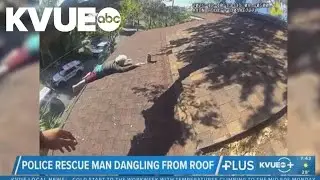 Police rescue Florida man dangling from roof