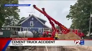 Cement truck tips over into construction site in Taunton
