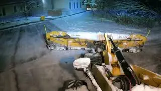 Plowing snow Metalpless plow and a cat 908 loader