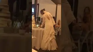 Groom gets his bride back for smashing cake in his face.