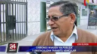 Camiones invaden v&iacute;a auxiliar de la avenida Alfredo Mendiola (1/2)
