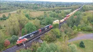 Awesome Aerial 4K View!  Long Extra Stack Train CN X121 Approaching Pacific Junction, NB