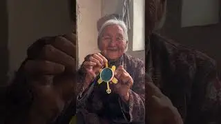 Here, I'll give you a little moving turtle to play with. #Grandma #RuralLife