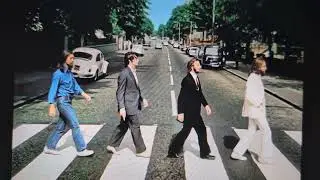 Brand new Beatles A.I. slop song Abbey Road album cover