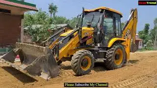 JCB Backhoe Loader pushing Mud in new road constriction