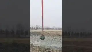 Long boom #excavator descends onto construction site, live footage
