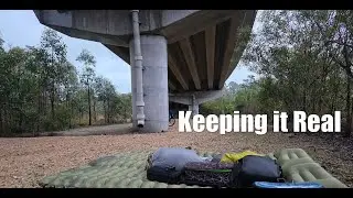 Keep it real by stealth camping under a bridge in the rain