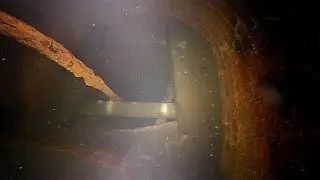 Flooded well room leading to a well shaft.