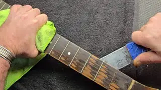 Guitar repair.  removing the fretboard on an old archtop . 