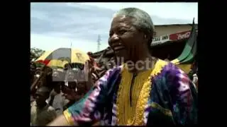 MANDELA:FELLOW PRISONER-EMBRACED BY HIS JAILERS
