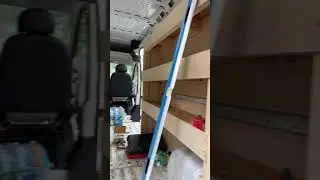 installing shelves into a van