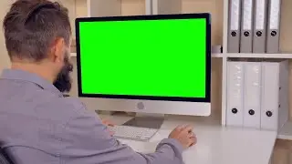 Businessman working on the computer with Green Screen