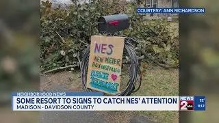 Some residents resort to yard signs to catch NES' attention