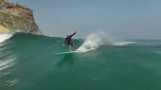 Surfing longboard in Angola