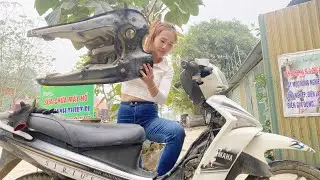 The talented girl repairs a YAMAHA SIRIUS motorcycle with a broken engine.
