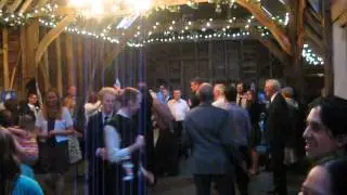 Traditional wedding barn dance in a lovely old English barn