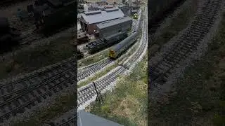 Class 411 heads up the back straight.