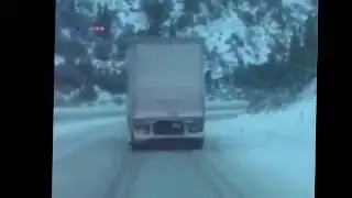 Fedex truck slides down icy interstate I-80 during snowstorm