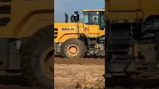 SDLG wheel loader clearing access road