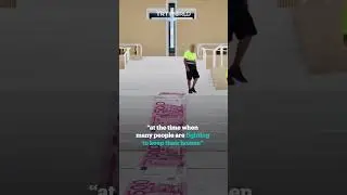 Portuguese artist rolls out banknote carpet to slam pope's visit costs