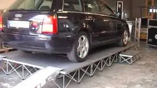 Intellistage: Car being driven on to Intellistage portable staging system