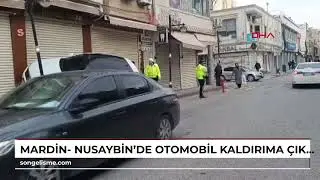 Mardin- Nusaybin&rsquo;de otomobil kaldırıma &ccedil;ıkıp iş yerinin kepengine yaslandı