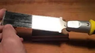 Wax carving removing excess material using the Japanese saw