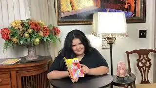Carly reads Nighty Night Sesame Street to Lilly