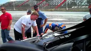 Kyle Busch working on his TD Bank 250 car at Oxford Plains Speedway