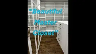 Luxury White Walk-In Closet with Island and Mirrored Doors | Neatly Dunn Closets