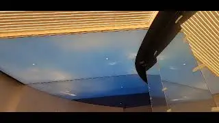 Illuminated stretch ceiling with graphic and backlit