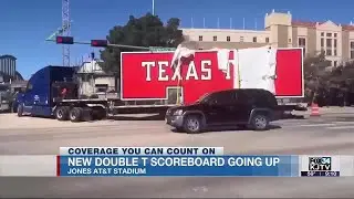 Double T scoreboard going up at Jones AT&T Stadium