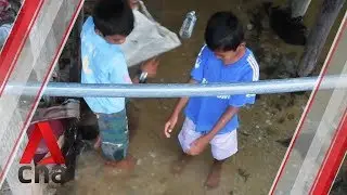 Sabah's forgotten children, living in a sea of trash