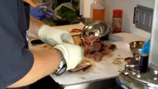 Scottie Johnson of Cancersuckschicago com pulls pork at the Shannon BBQ Competition.