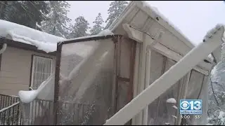 Residents in the foothills using break in storms to clear snow from roofs