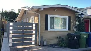 Santa Monica Home Updates Old Wooden Gate with a Modern Look