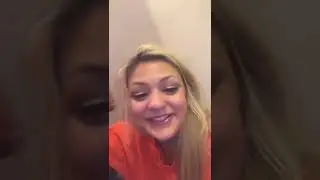 Woman In Orange Jump Suit In Jail On Her Phone
