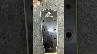 Preparing tools to repair the abandoned vintage Gibson guitar