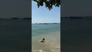 Kids are happy to play in the sand at the beach