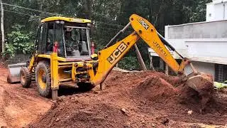Jcb 3dx digging and gathering soil