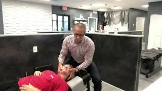 A demonstration of a neck adjustment for neck pain by St. Charles Chiropractor Glenn Ezell