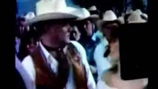 Something funny between Larry Hagman and Victoria Principal.