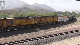 Union Pacific Manifest with Mid-Train DPU meets BNSF Z-Train with Warbonnet at Cajon Pass - 4/24/21