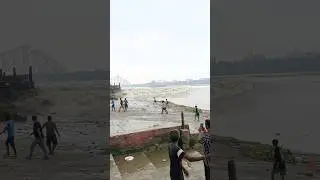 A huge wave of rain in the banks of the river Ganga on the full moon day.